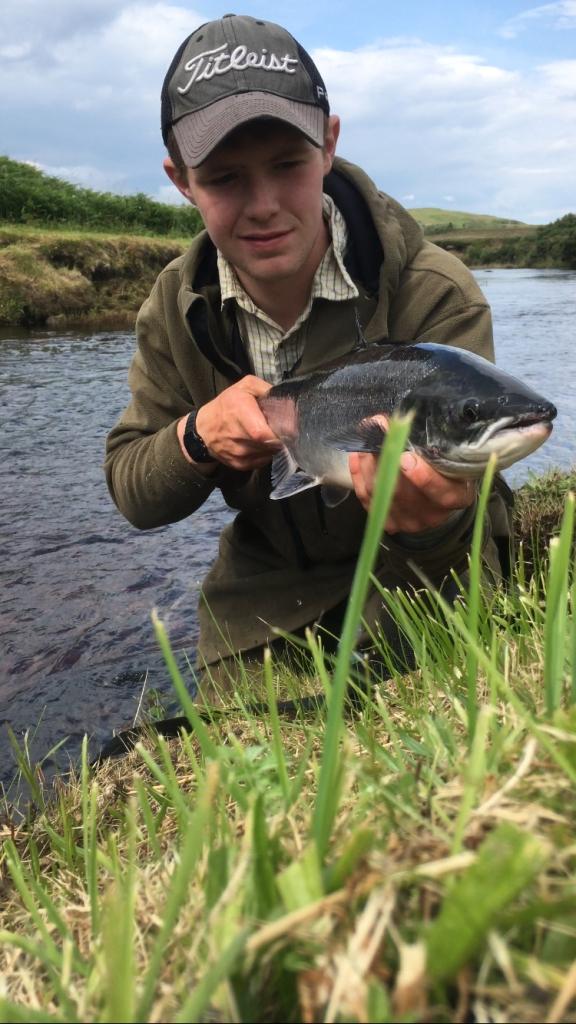 Cameron MacLean holding a fish