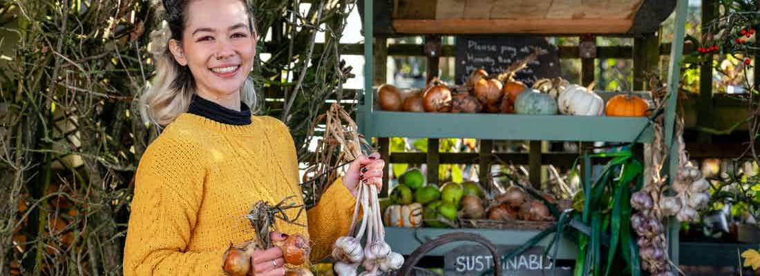 young horticulturalist selling organic garden produce