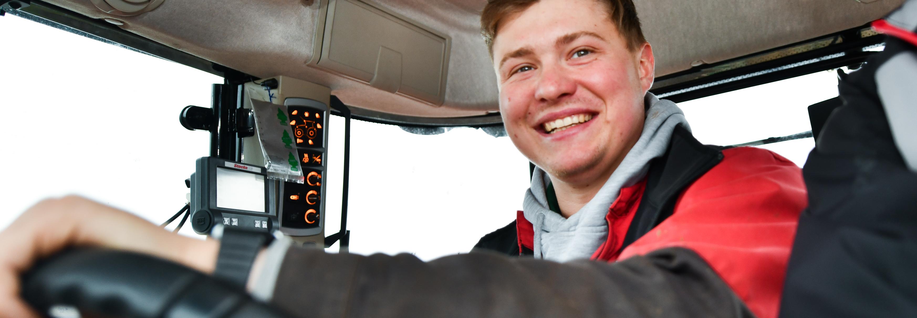 Matthew Douglas driving tractor