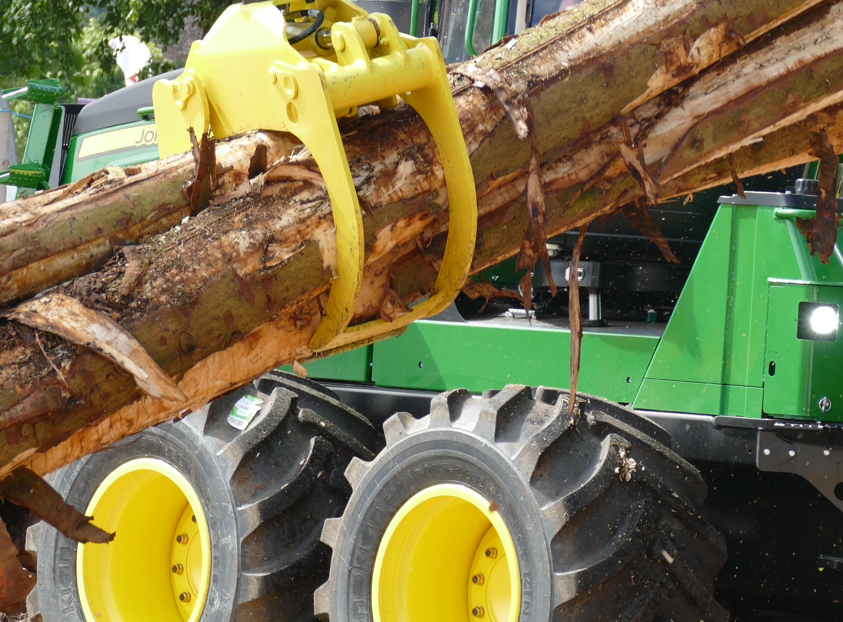 Machinery lifting logs