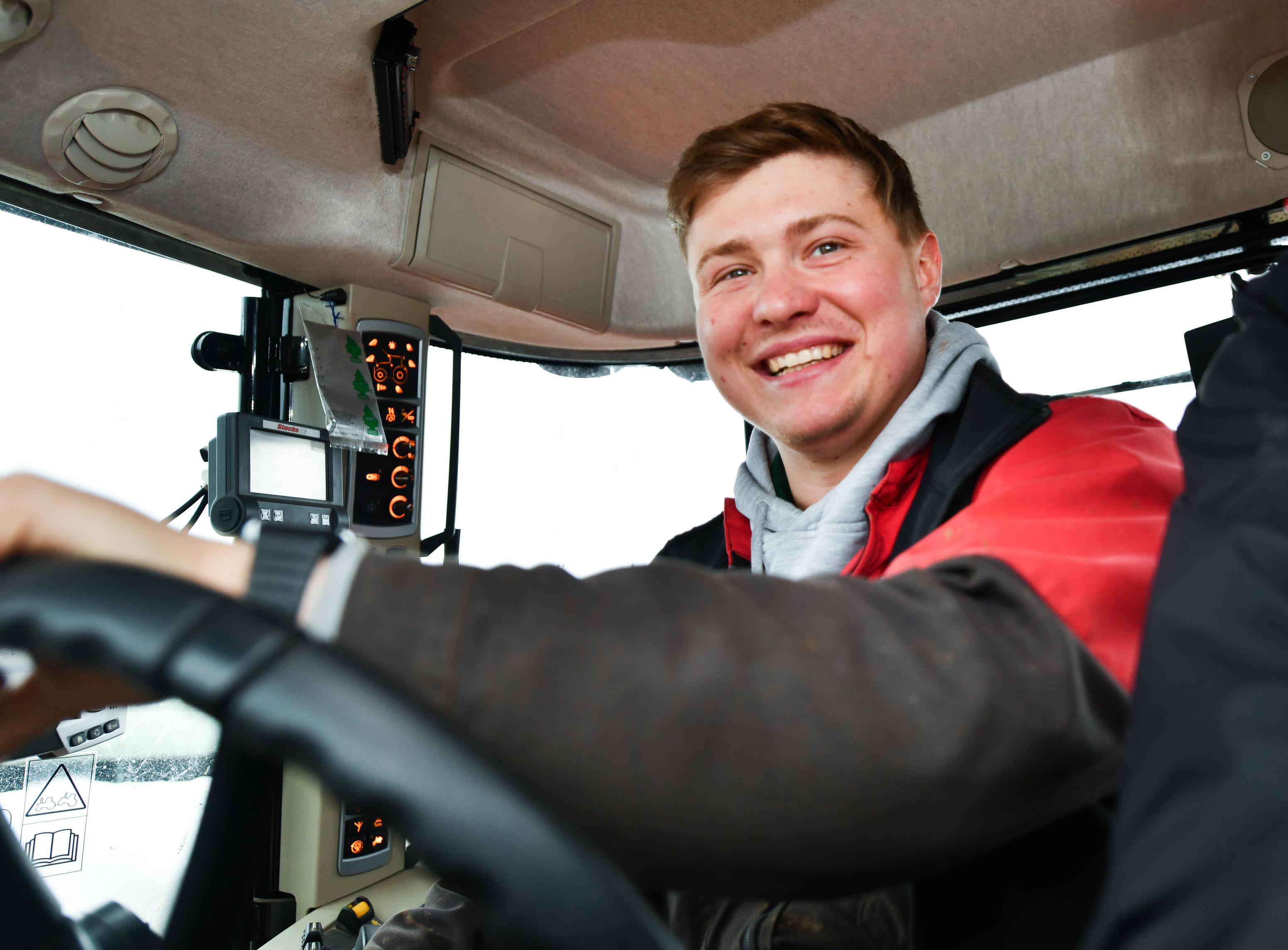 Matthew Douglas driving tractor