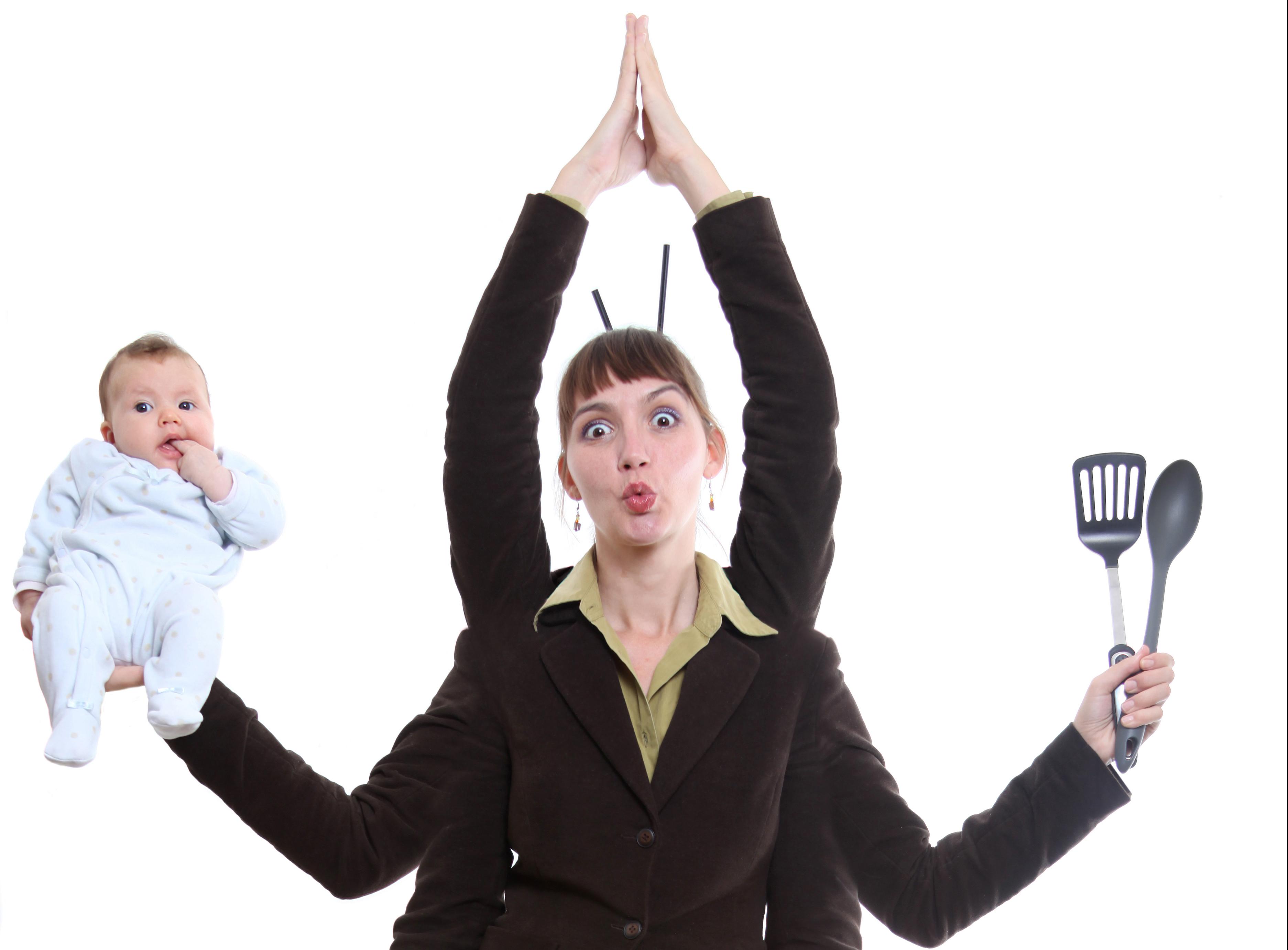 Woman multi-tasking holding child