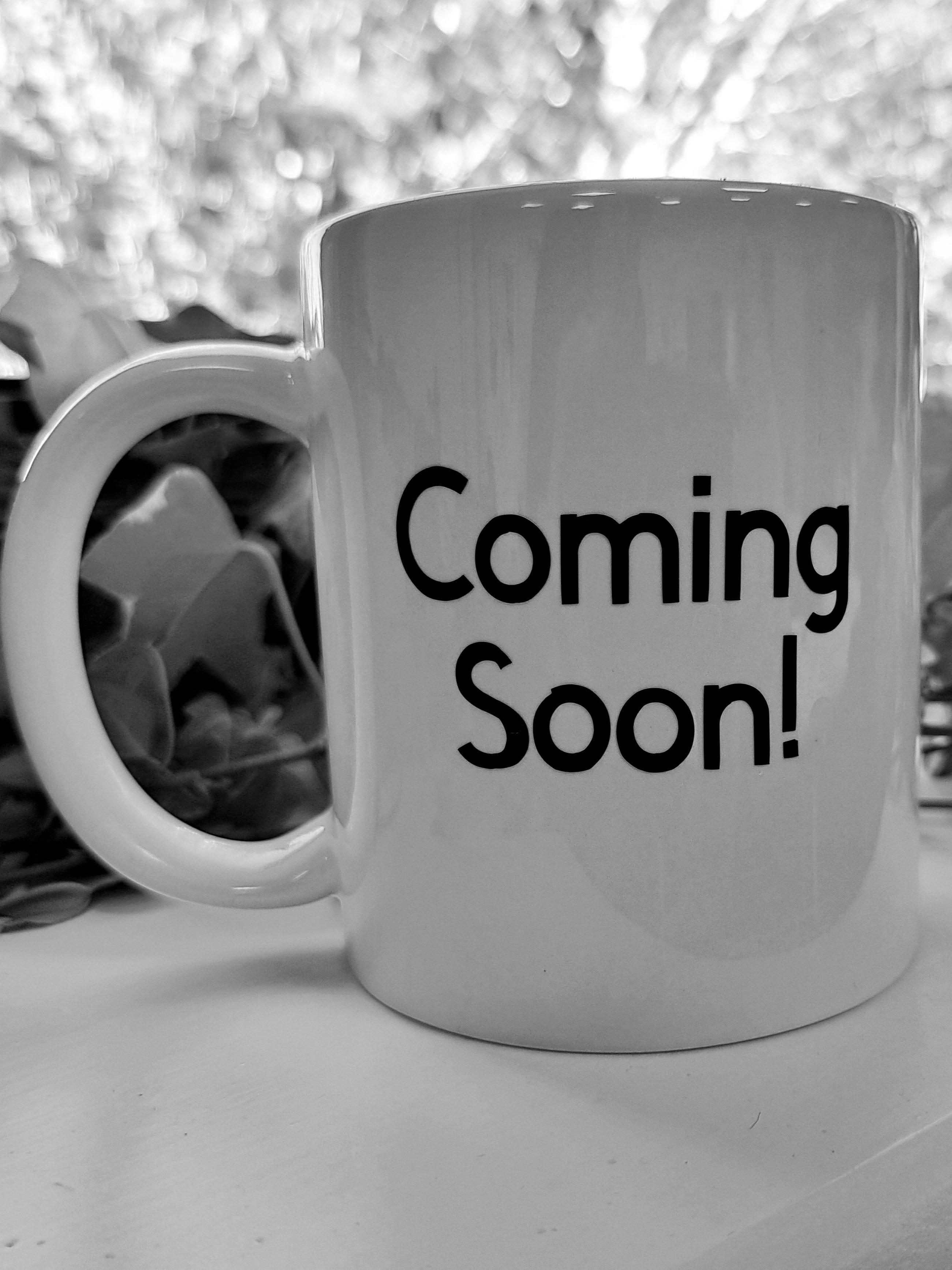 Mug with coming soon printed on it