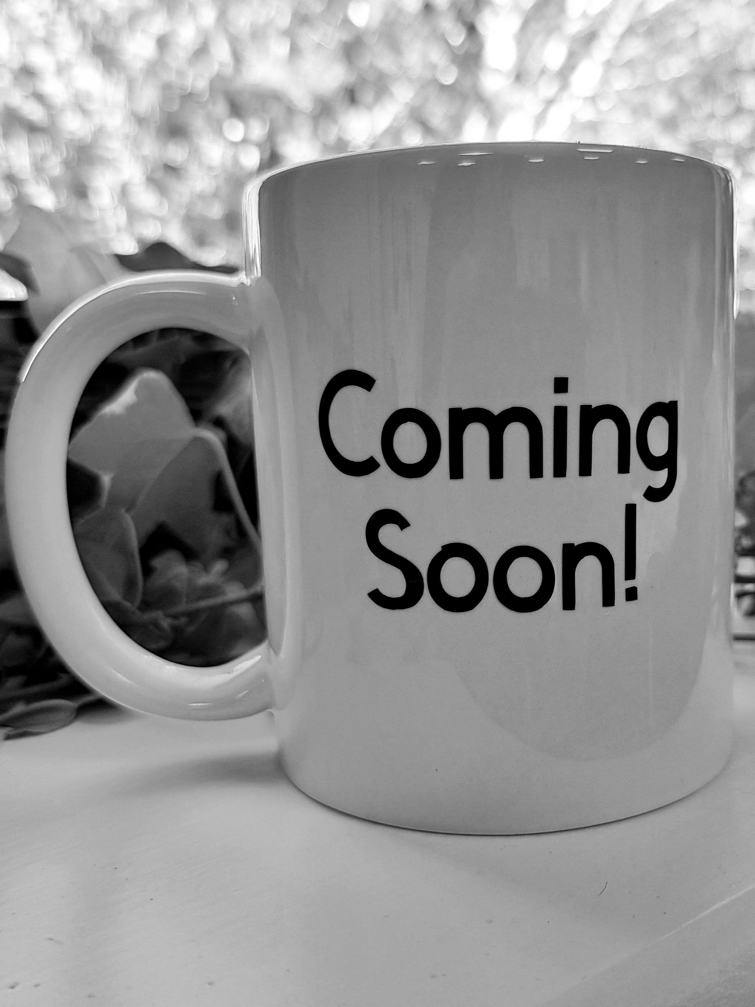 Mug with coming soon printed on it